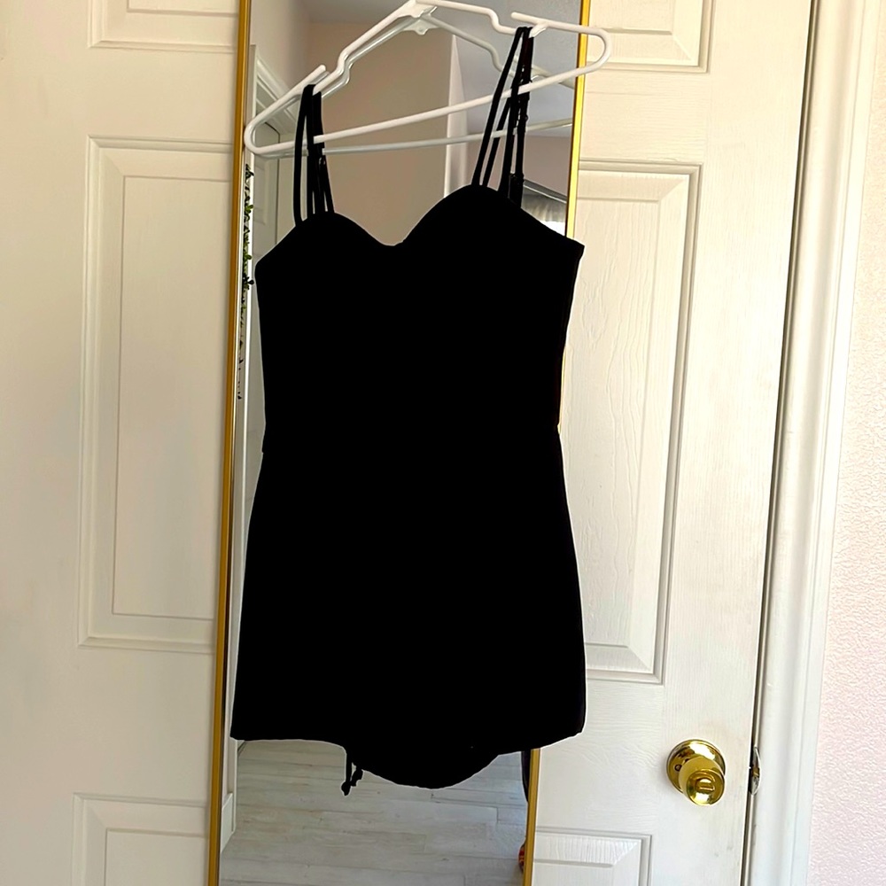 Never been worn Bebe romper size 4.